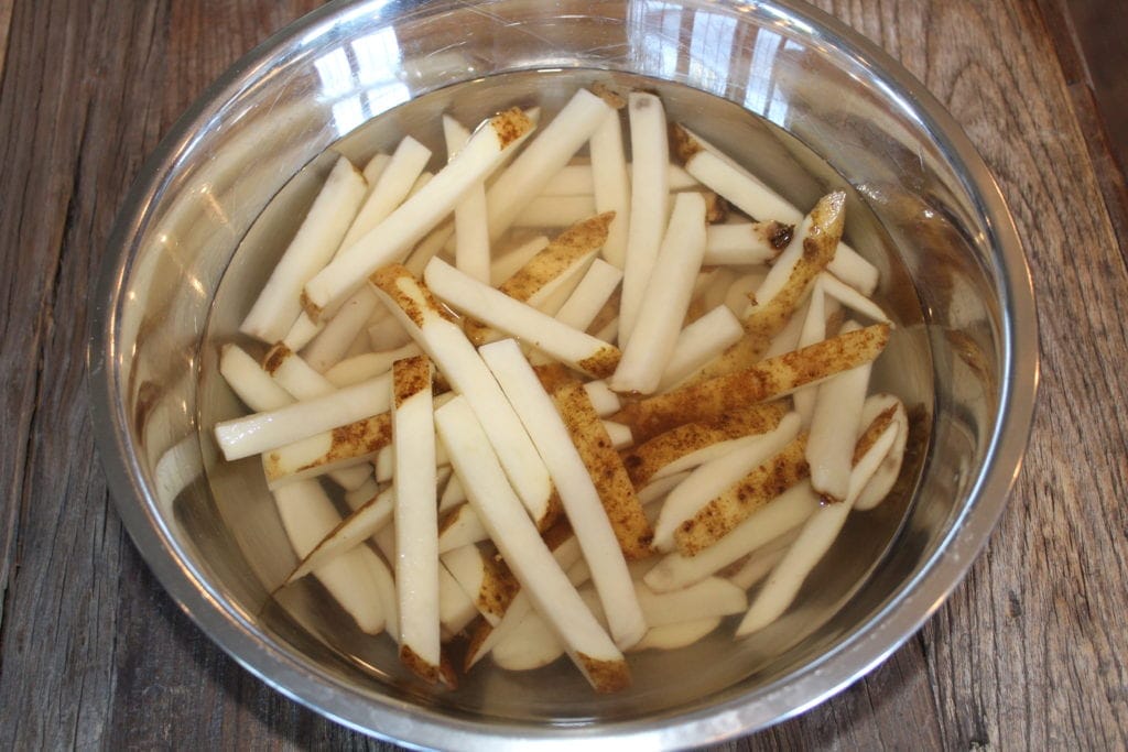 This recipe calls for a secret ingredient that makes these fries crispy on the outside and soft on the inside. Whole30 approved and easy to make. #Fries #potato #Whole30 #sides