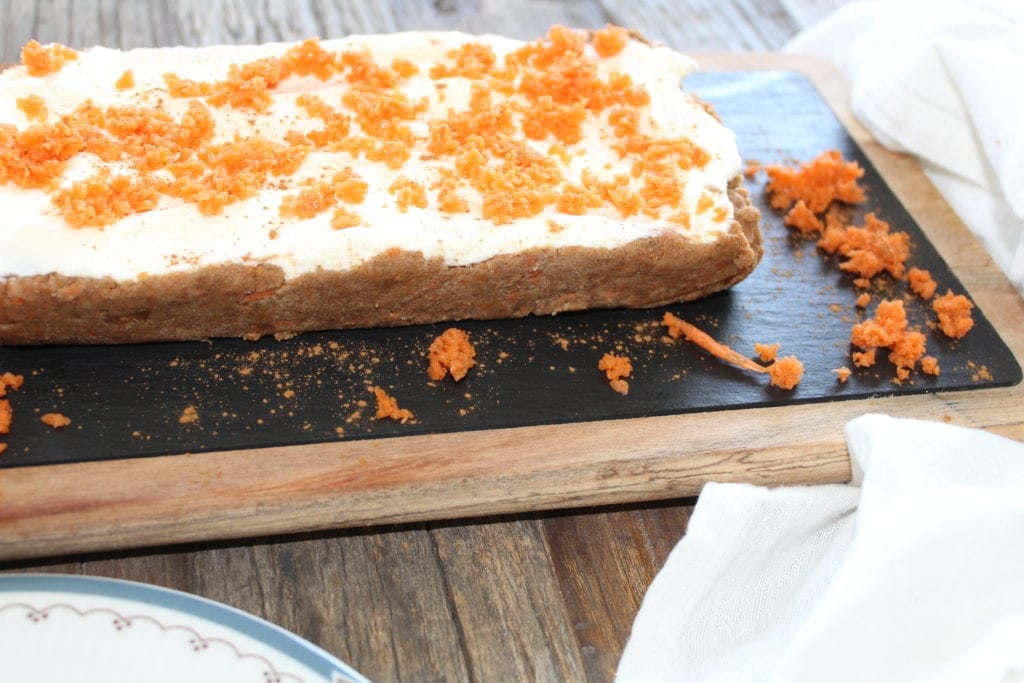These bars only take minutes to prepare. The hardest part waiting for them to solidify in the fridge. Combining almond flour, coconut flour, pureed carrots and butter, these dense little treats will become a regular addition to your families desserts. #Low Carb #keto #carrot Cake #bars #gluten Free #easy.