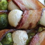 Easy and delicious, this recipe comes together with only 3 ingredients and 5 minutes of time. Simply skewere onions alternating with brussel sprouts and then wrap the entire skewer in bacon. Whole30, low carb and delicious! #whole30 #low carb #healthy #bacon #onion #brussel sprouts #easy #delicious #appetizer #sides #skewers