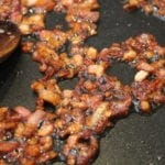 Delicious Whole30 approved smokey barbecue sauce. By simply cooking onions and bacon and then adding a tomato base and a couple of spices, you can have a keto, low carb, sugar free BBQ sauce in minutes!
