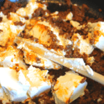 Simply combine cooked chorizo, cream cheese, Boursin in a cast iron skillet. Top with cheddar cheese and the keto chorizo dip is complete.