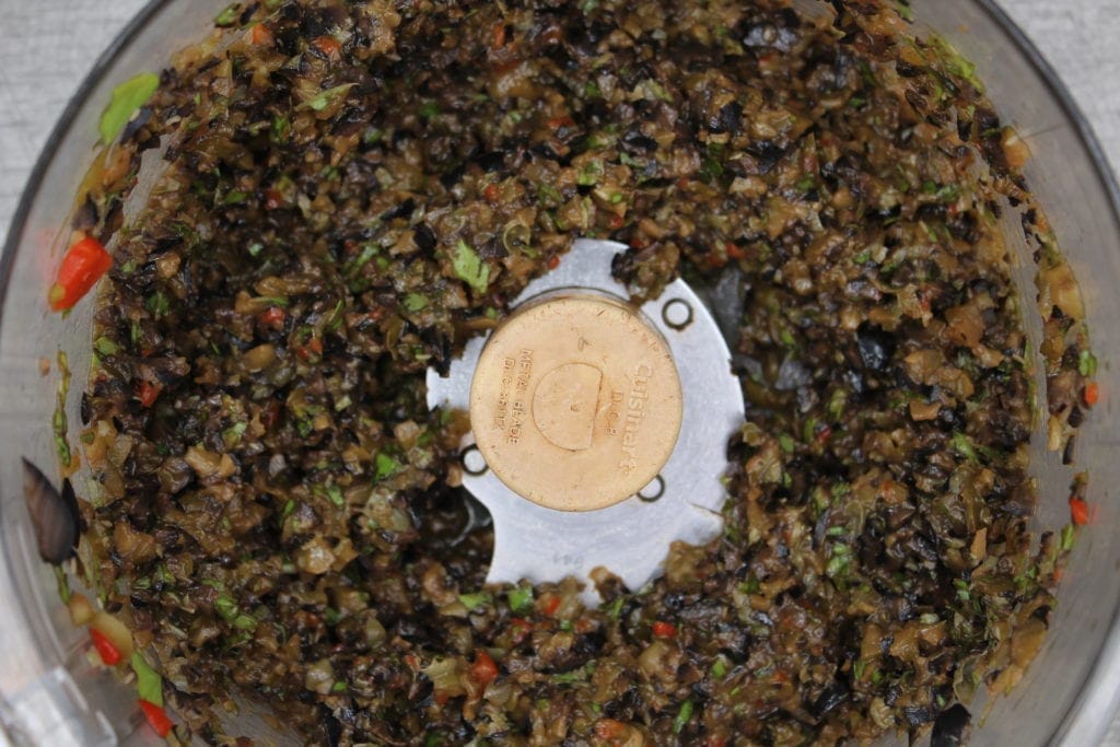 Simply combine olives, basil, capers, sundried tomatoes and some garlic and within minutes, you have a delicious sundried tomato olive tapenade. Low carb, gluten free and keto.