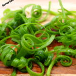 Thinly slicing onions and placing them in a bowl of ice water creates these beautifully curled onions. Impress your guest with a simple and elegant decoration at your next party.