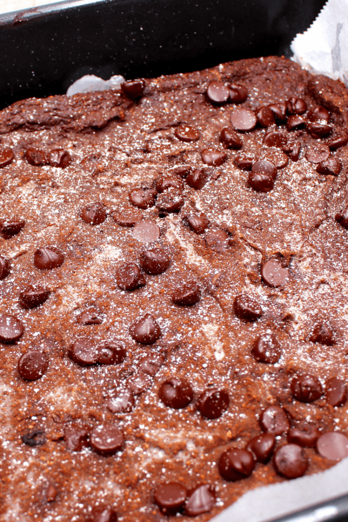Mint Avocado Brownies baked with a dusting of powdered sugar