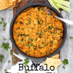 top view of skillet with buffalo chicken wing dip