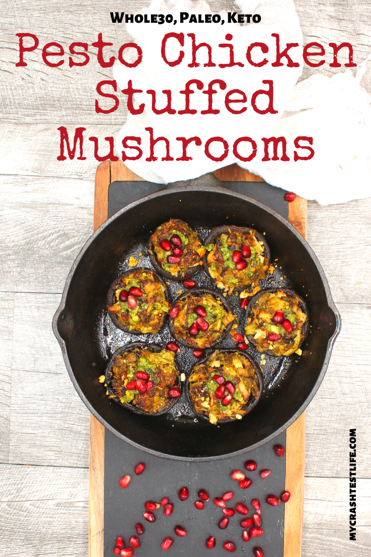 Pomegranate seeds on top of chicken pesto stuffed mushrooms