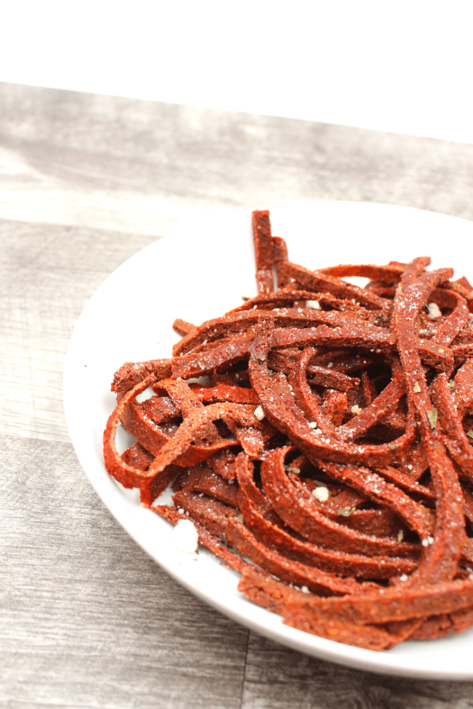 Homemade beet noodles with parmesan