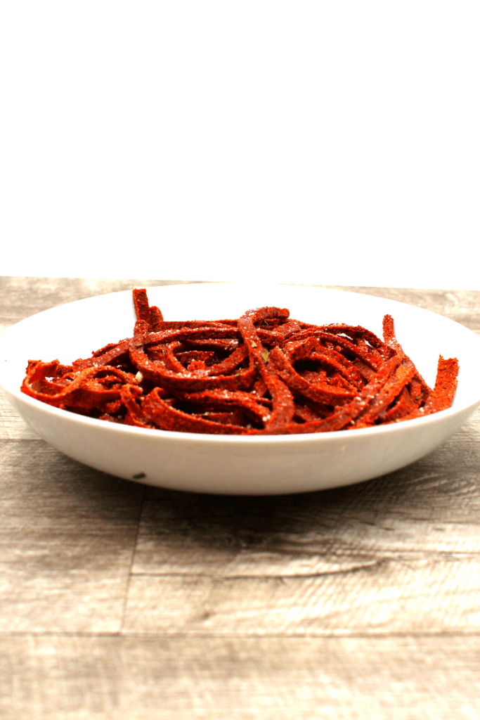 A bowl of plant based beet noodles