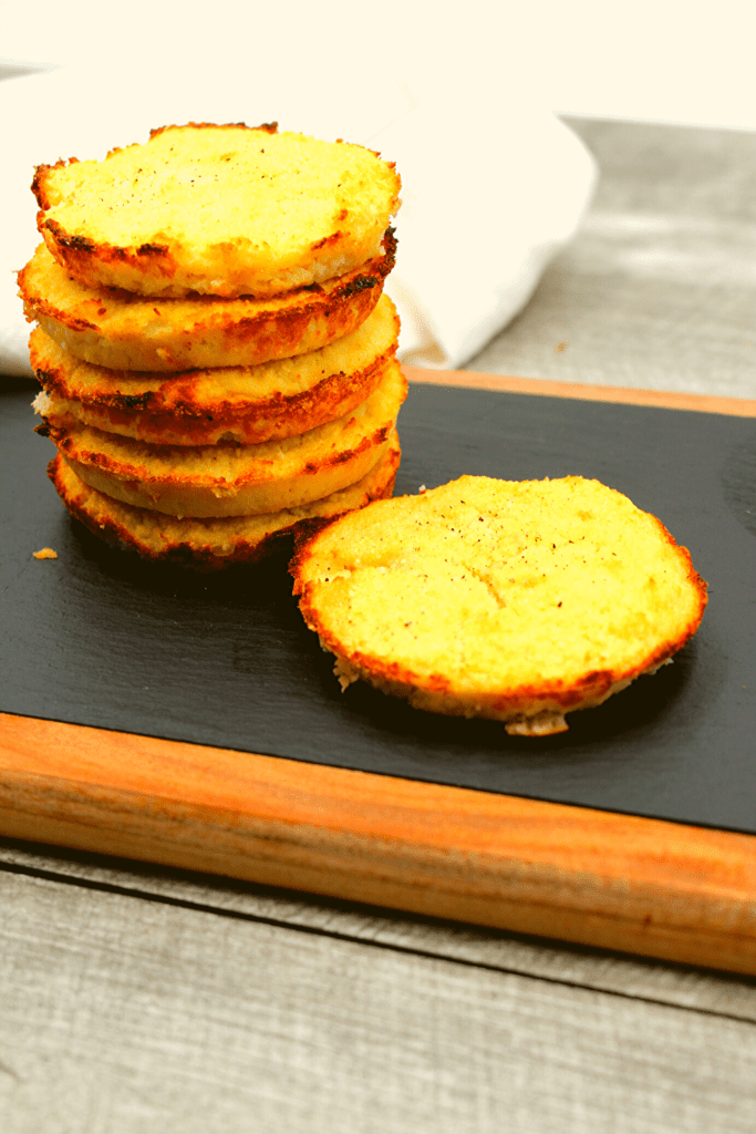 A stack of healthy Whole30, Paleo and Keto Riced Cauliflower patties.