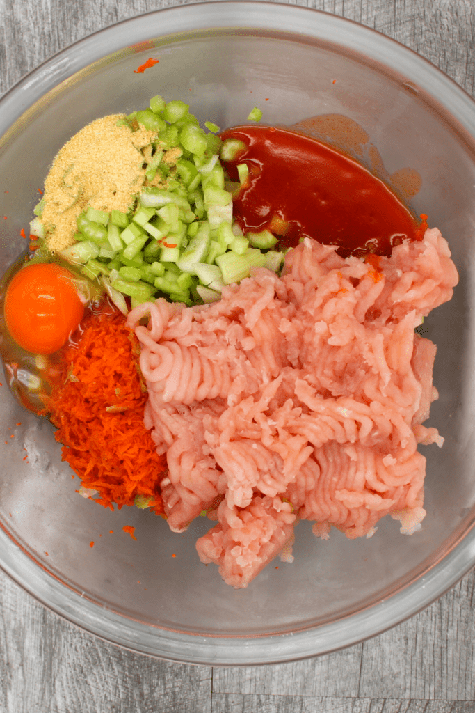 All the ingredients in a bowl to make the whole30 and paleo meatloaf.