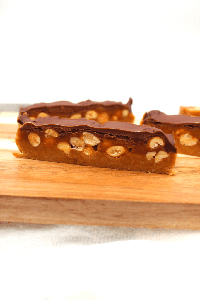 Keto and gluten-free, these peanut and caramel layered bars are absolutely delicious.