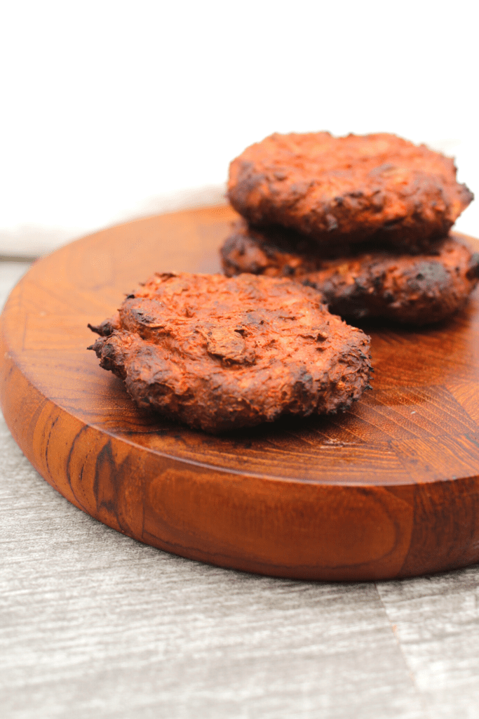 Making these plant-based, vegan, Whole30 and Paleo jackfruit and beet burgers in the air fryer helps to crisp them up.