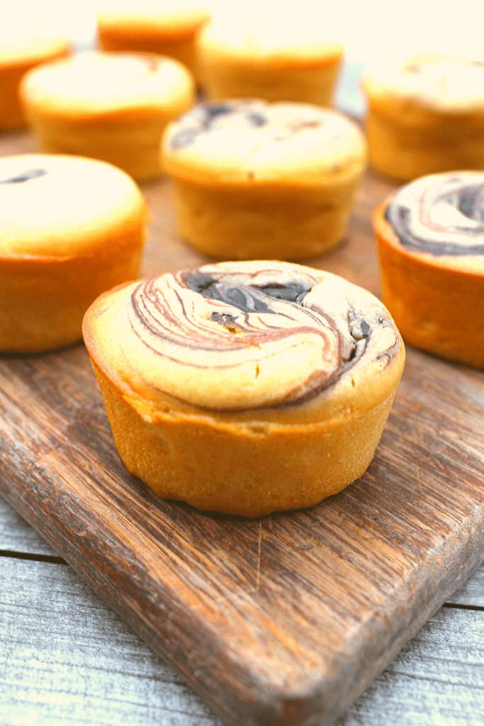 Perfect chocolate swirls adorn these gluten-free and keto muffins.