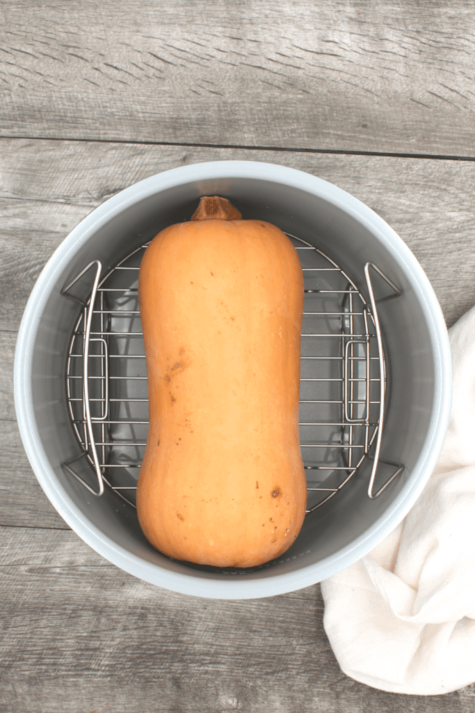 Place the butternut squash in an instapot or pressure cooker for a quick and easy way to cook the squash.