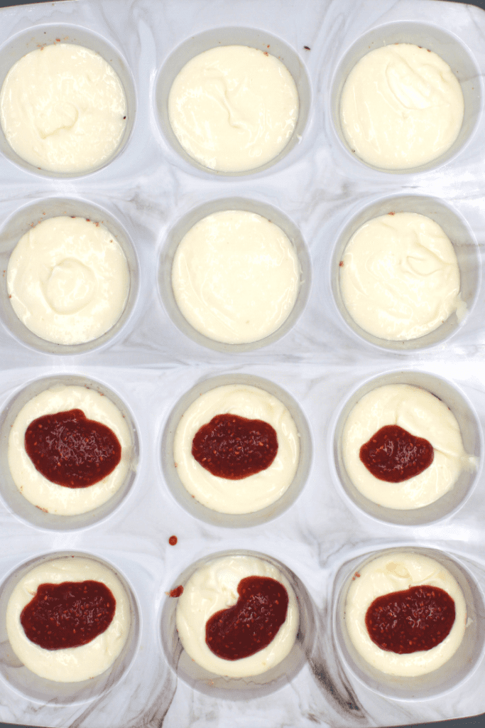 Adding the jam to the cheesecake in the middle layer helps to make sure the jam is swirled throughout the keto muffin.