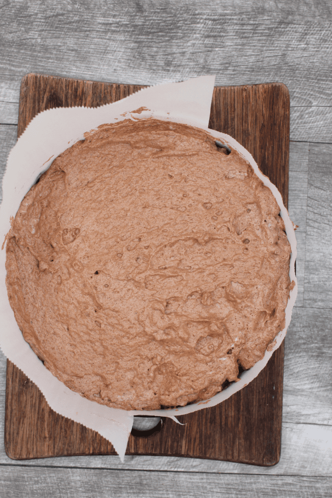 Top the flourless brownie base with a light and delicious chocolate souffle.