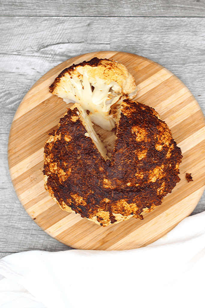 A view from above of this perfectly chili rubbed cauliflower head made in the air fryer.