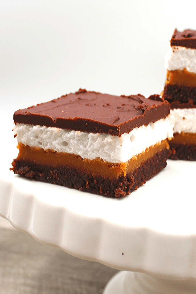 Light keto marshmallow sandwiched between peanut butter fudge and chocolate