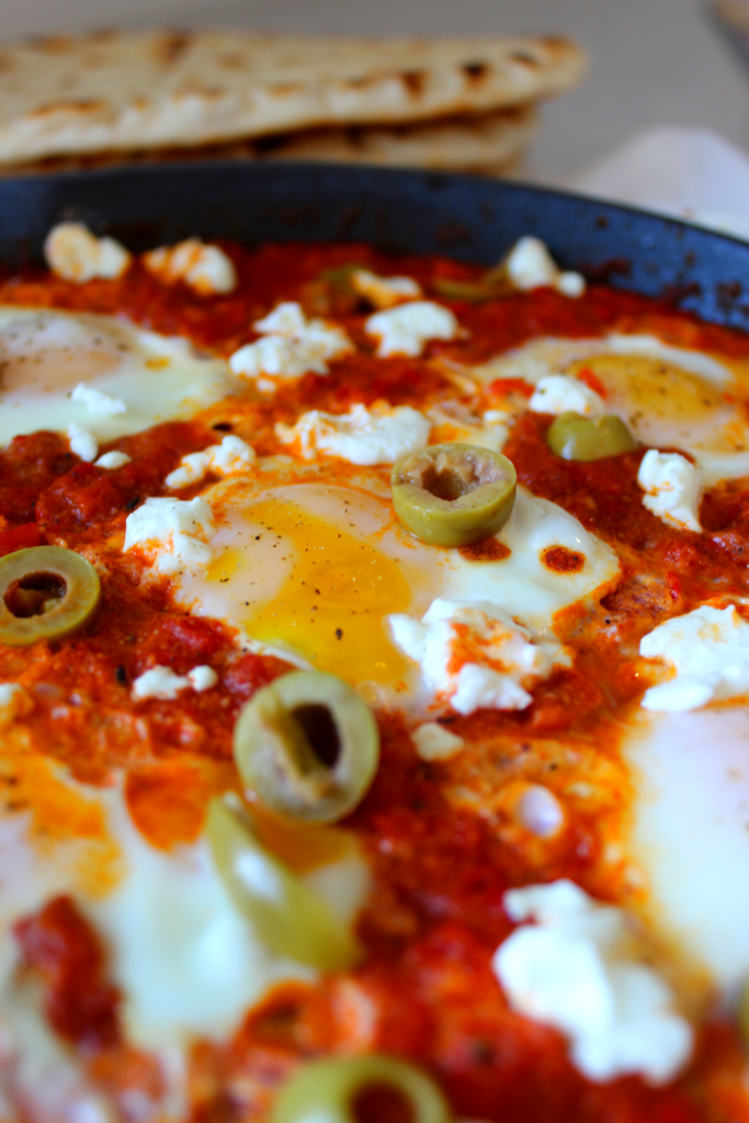 A thick tomato and pepper spice sauce cooks these eggs perfectly.