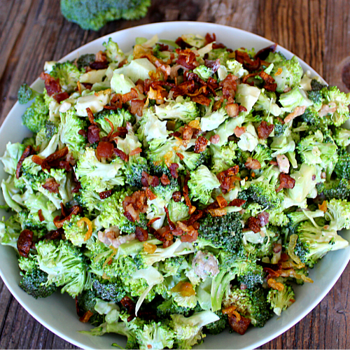 A bowl of broccoli and bacon in a creamy maple dressing