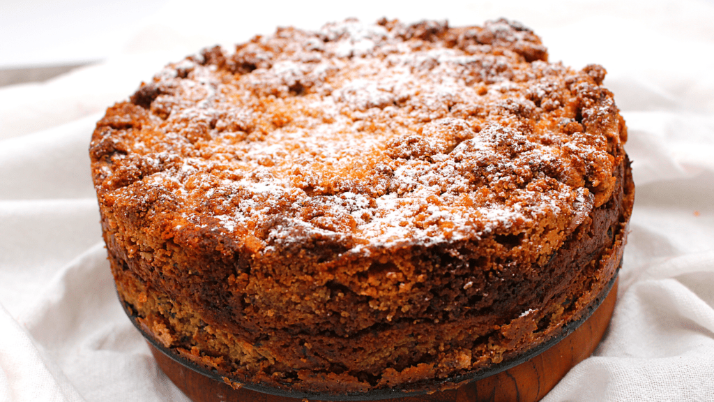 A dusting of powdered sugar over the crumb cake