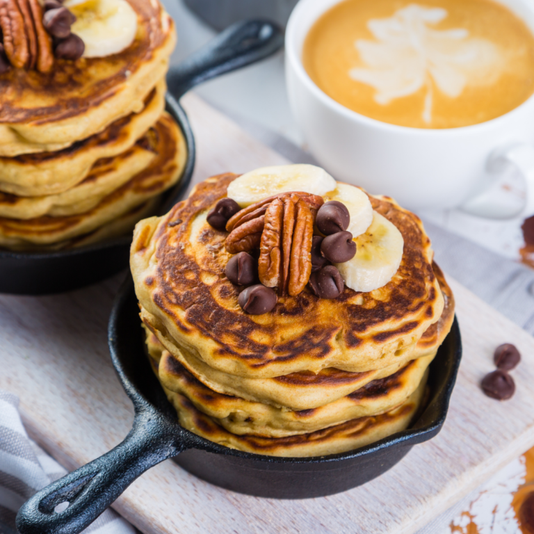 a skillet filled with mini pancakes that are gluten-free, dairy-free and keto