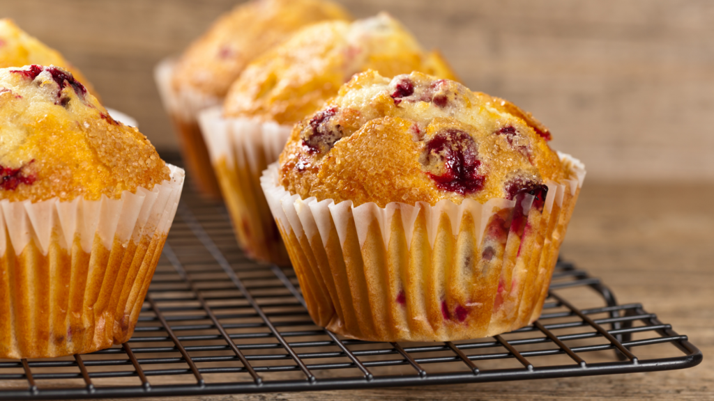 cranberry muffin on a cooling rack