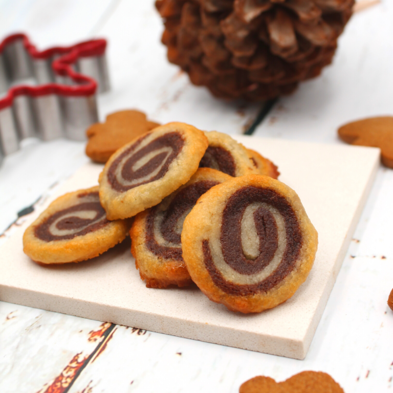 a plate of chocolate spiral cookies