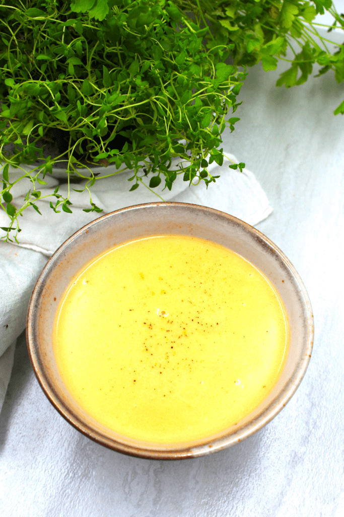 a spinkling of pepper over the mustard sauce
