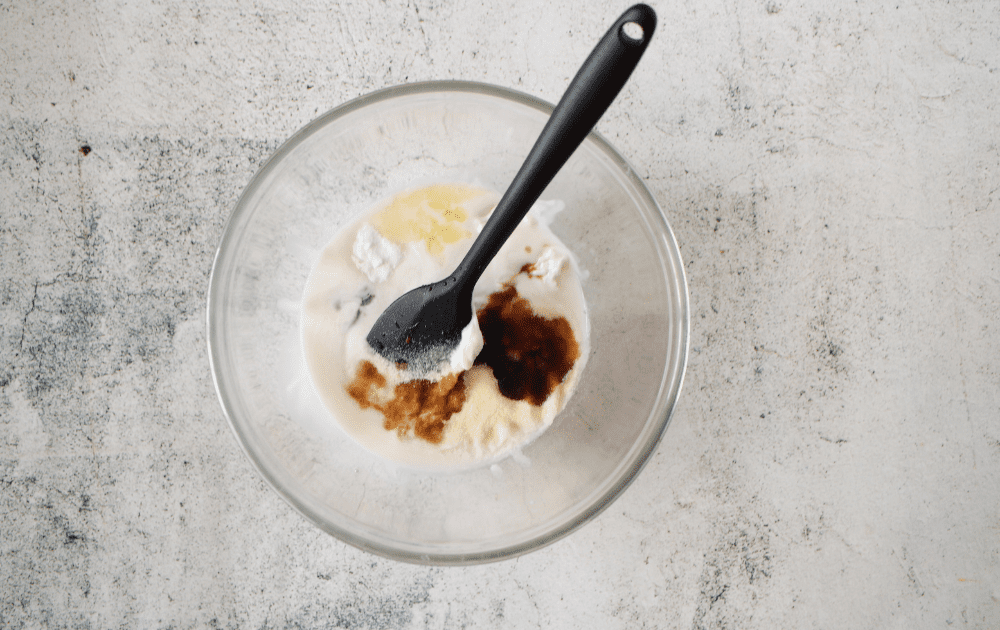 a bowl with cooled coffee cream and cream cheese before being whisked