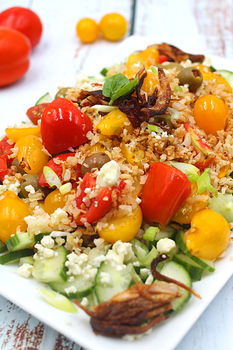 roasted cauliflower and tomato salad on a plate