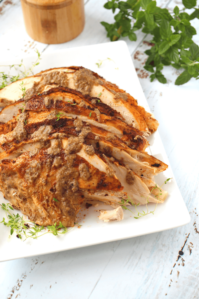gravy on top of sliced turkey breast