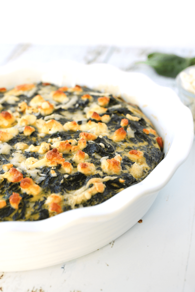 healthy spinach casserole baked in a pie dish