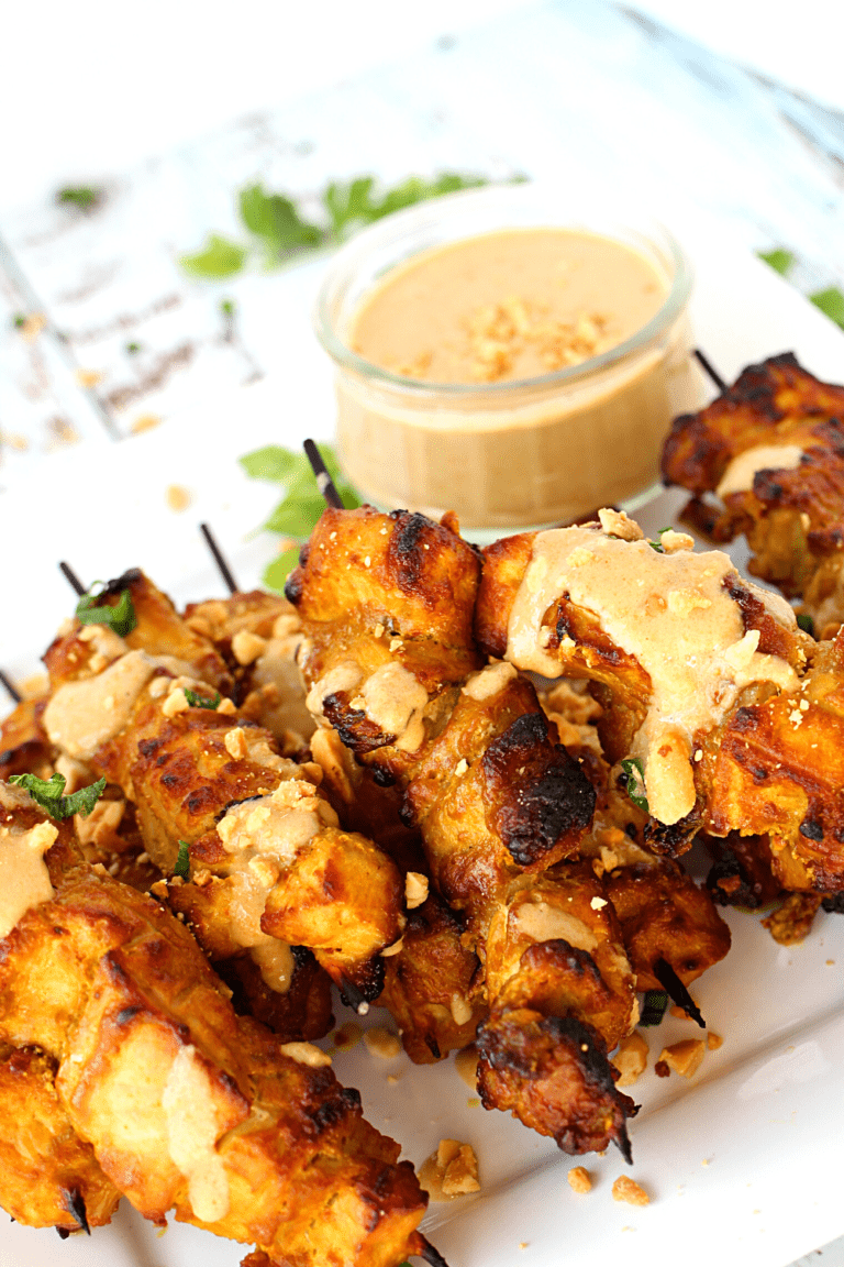 pork satay skewers with a side of easy peanut sauce