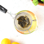 use a fine-mesh strainer to remove the herbs from the simple syrup