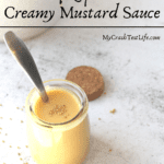 keto creamy mustard sauce with a spoon
