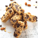 keto coconut chocolate chip bars piled on top of each other