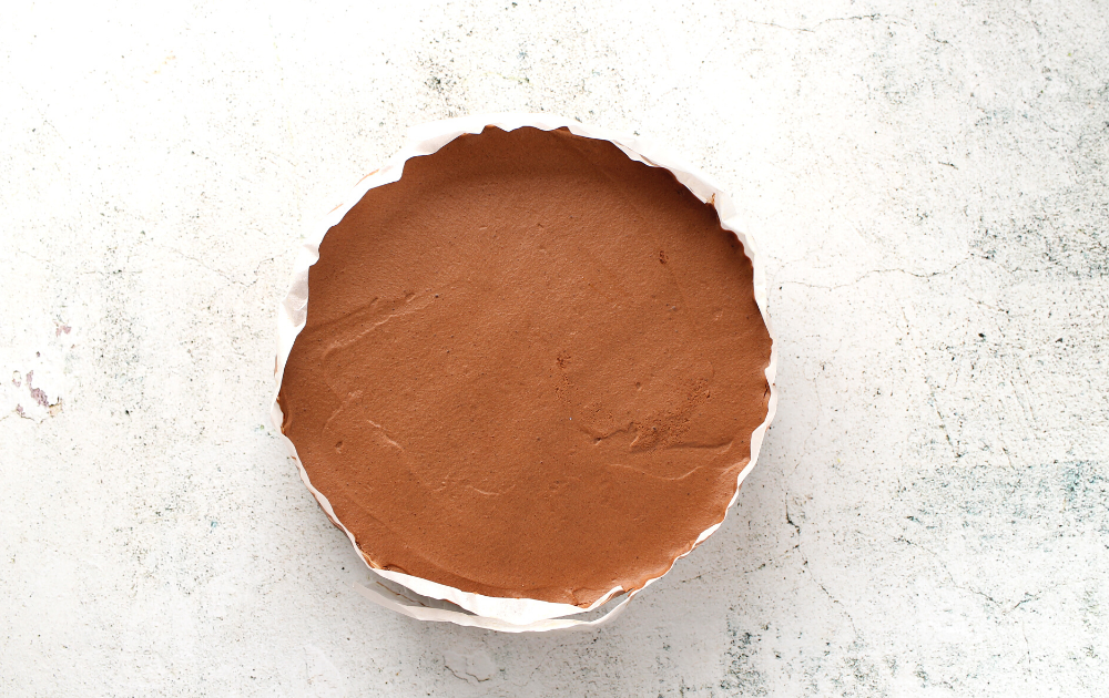 once the keto chocolate mousse has firmed, remove the pan and the parchment paper.