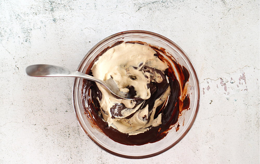 fold in ⅓rd of the heavy creamy to lighten the chocolate and then carefully fold the chocolate into the heavy cream