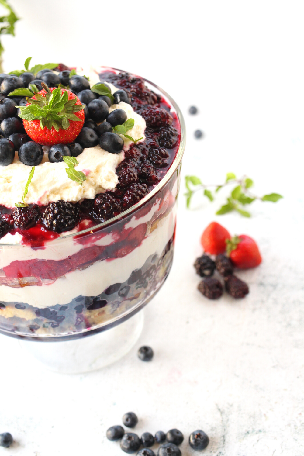 this keto berry trifle has 3 different berry layers with almond sponge cake and sugar-free whipped cream