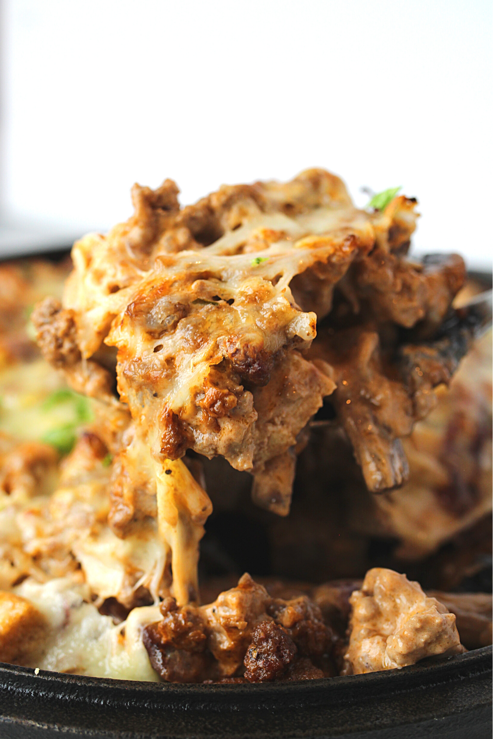 keto burger casserole made with mushrooms, bacon and swiss cheese