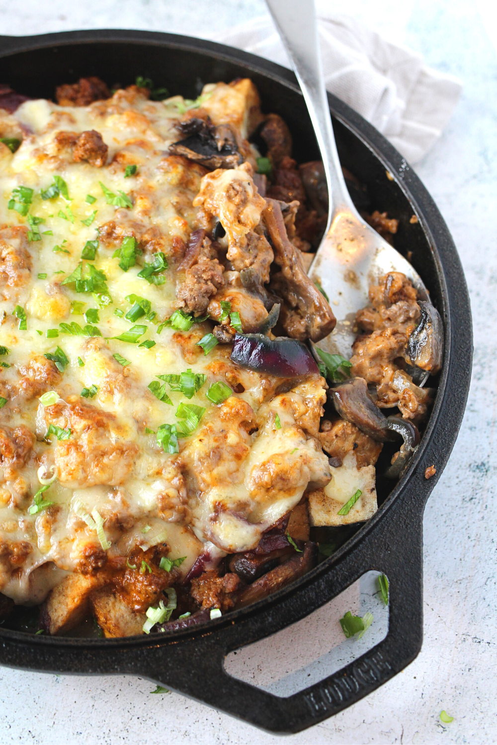 keto bacon mushroom swiss casserole made in a cast iron skillet