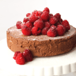 keto chocolate mousse cake topped with raspberries