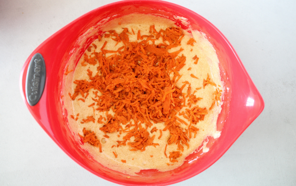 fold the carrots into the keto carrot cake batter
