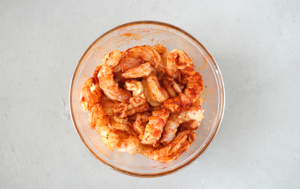 step 2 - toss the raw shrimp in olive oil and spices