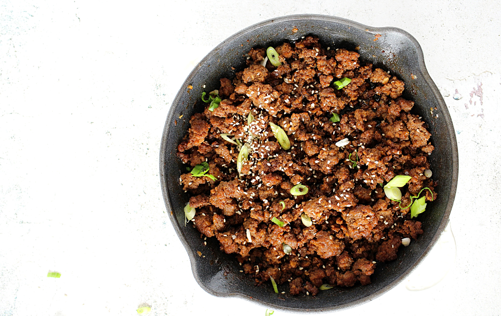 Step 2 - Cook the beef, add teh sauce and top with sliced green onion and sesame seeds