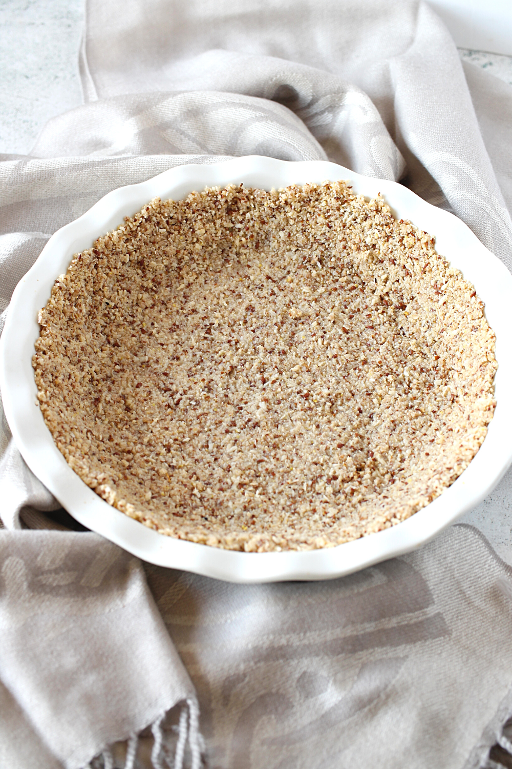 making a diary-free keto pie crust is really easy and only requires almond flour, coconut and flax meal.