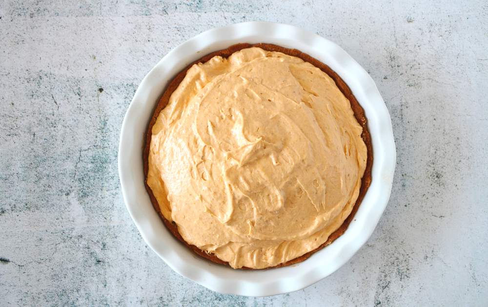 step 3 - Spread the creamy pumpkin filling onto the solid no-bake pie crust