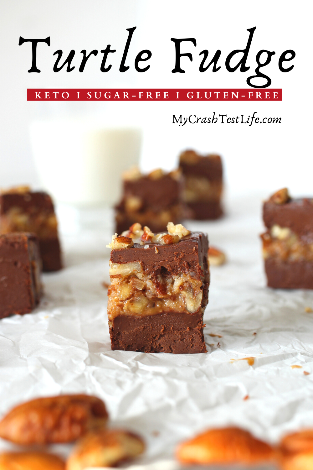 keto turtle fudge that has 2 thick layers of chocolate sandwiching a layer of caramel pecan