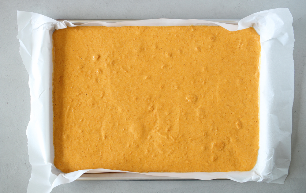 Instructions - Spread the pumpkin cake into the jelly roll pan and bake